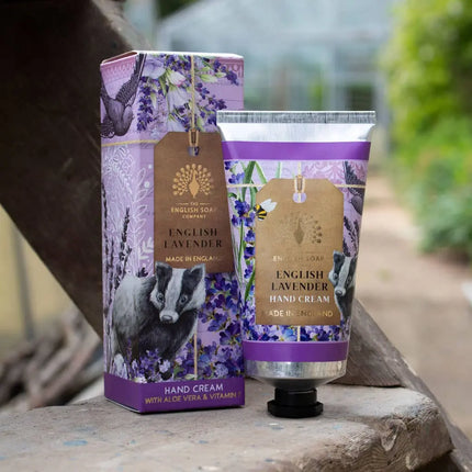 English Lavender hand cream and packaging on a wooden surface with a blurred natural background