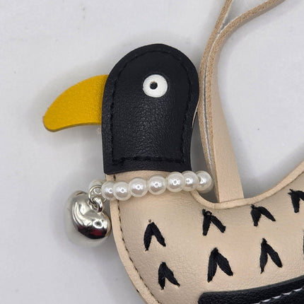 Close up of a bird bag charm