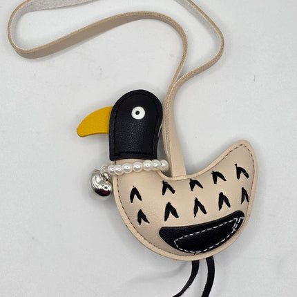 A bird shaped bag charm