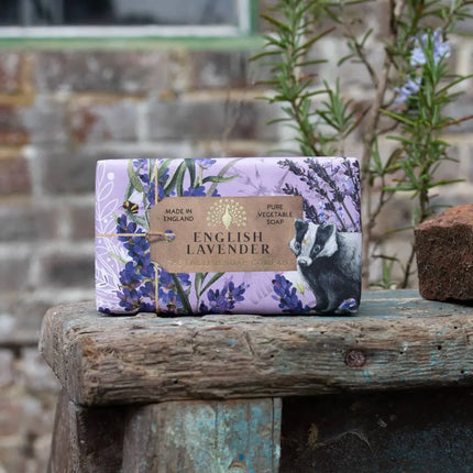 English Lavender soap bar with packaging on a wooden surface outdoors