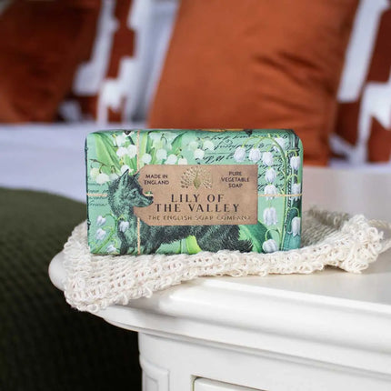 Bar of soap with 'Lily of the Valley' packaging on a textured surface