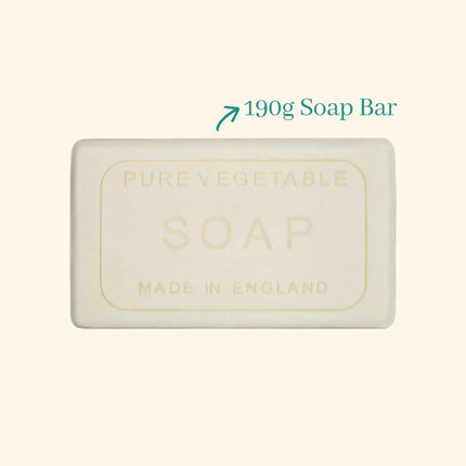 Bar of soap labeled 'Pure Vegetable Soap Made in England' with a weight indication on a beige background.
