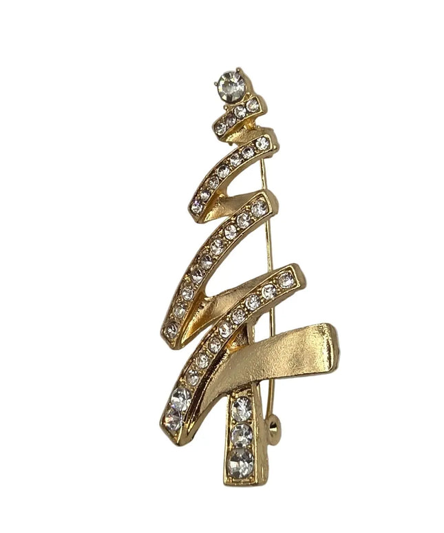 A gold Christmas tree-shaped brooch decorated with clear rhinestones, set against a plain light gray background.